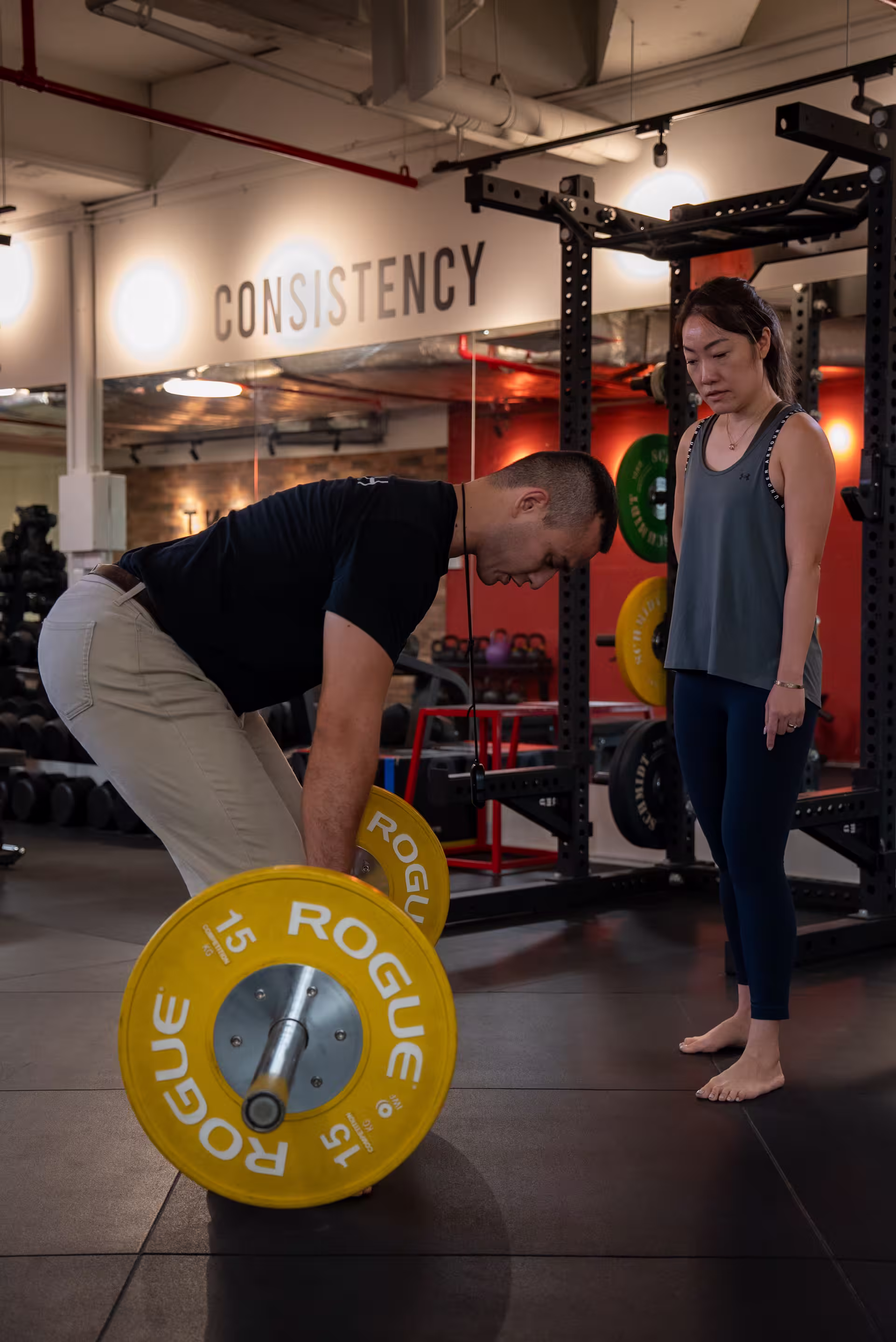 Coach guiding a strength session at Trident